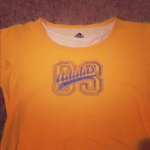 Adidas layered shirt yellow and white says 83